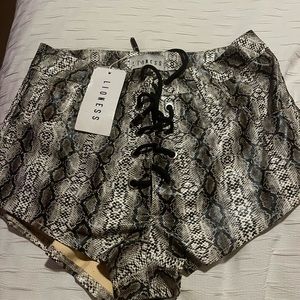 Lioness leather snakeskin shorts size large.